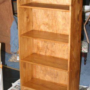 3/4 in solid pine shelves and sides, 1/2 in pine plywood back
Minwax Early American stain and satin polyurethane finish