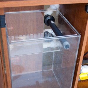 The Refugium Sump installed in it's cabinet. you can see the overflow baffles with .25" teeth. hopeful this will be enough to keep the micro algae con