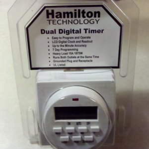 Dual outlet timer used to turn pumps on for one minute a day.