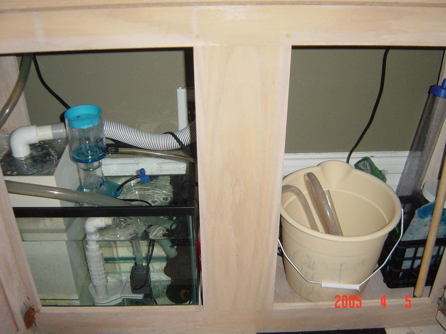 Here is my cannister and protein skimmer in the tank on left, and equipment on the right.