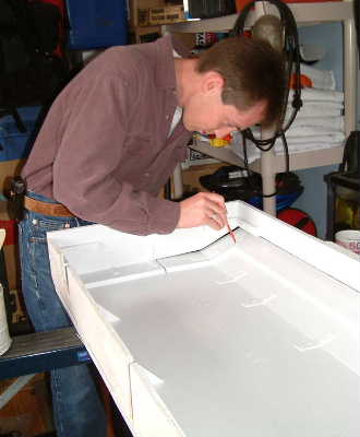 Here is Trevor finishing up the hood for the 80 gal.