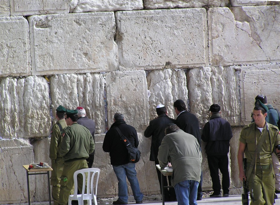 Picture taken from steps above the kotel. Soldiers and jews come to the kotel to mourn the loss of the temple.