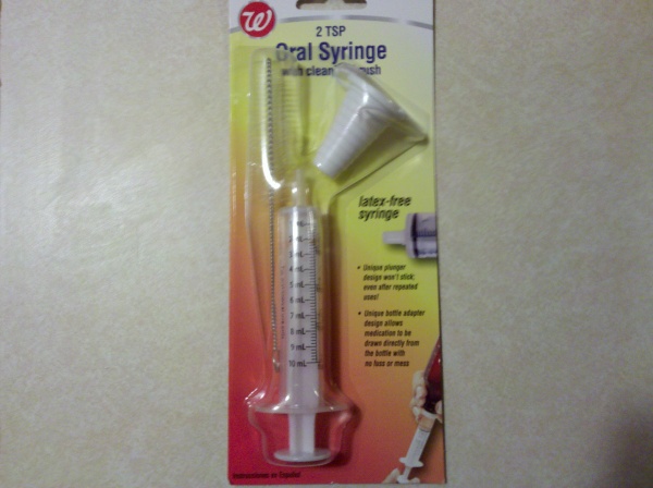 Syringe used to take the 1/2" outflow of the pumps to 3/16" airline tubing.
